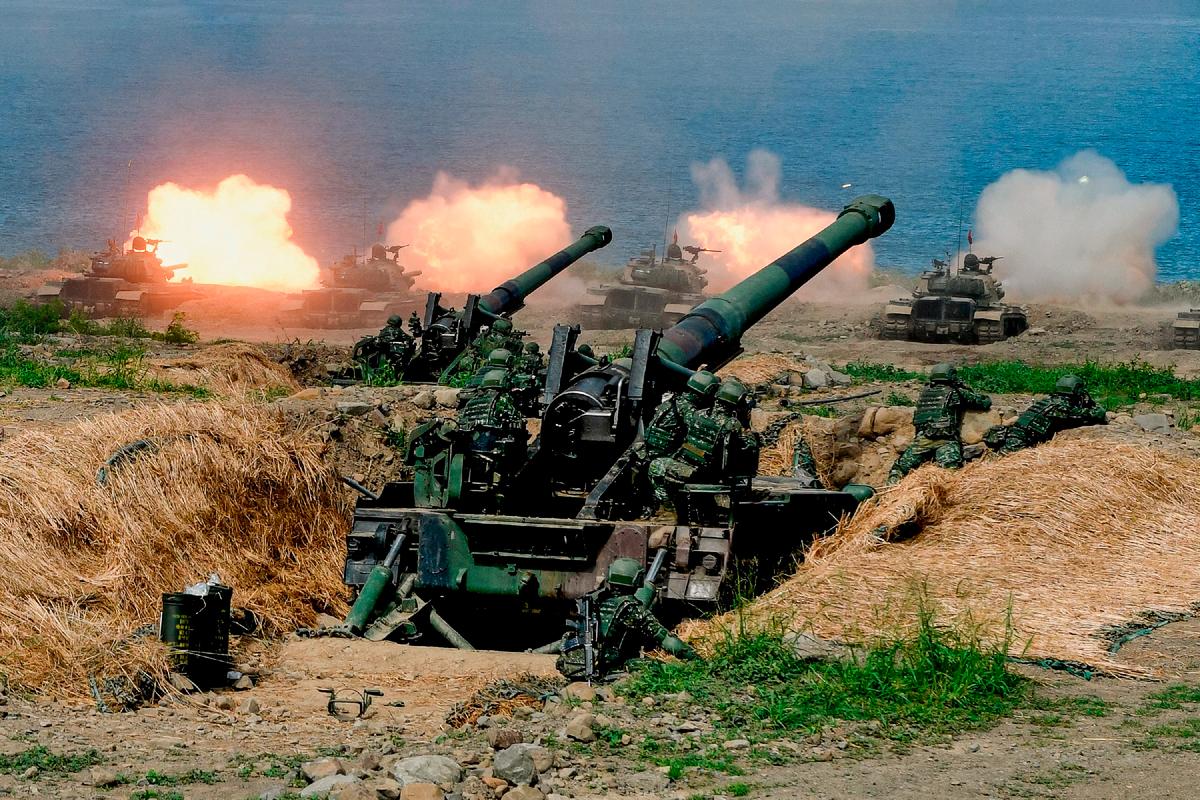 U.S.-made CM-11 tanks (in background) are fired in front of two eight-inch self-propelled artillery guns during a military drill in Pingtung County, Taiwan, on May 30, 2019. (SAM YEH/AFP via Getty Images)