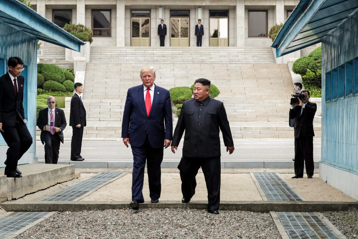 North Korean leader Kim Jong Un and U.S. President Donald Trump inside the demilitarized zone separating South Korea and North Korea, in Panmunjom, South Korea, on June 30, 2019. (Handout/Dong-A Ilbo via Getty Images)