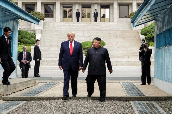 North Korean leader Kim Jong Un and then-President Donald Trump inside the demilitarized zone (DMZ) separating the South and North Korea, in Panmunjom, South Korea, on June 30, 2019. (Handout/Dong-A Ilbo via Getty Images)