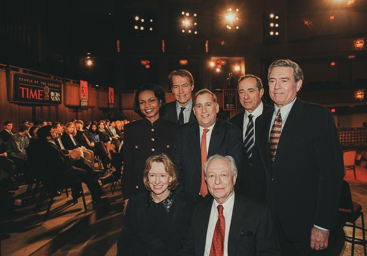 L to R front: Pulitzer prize-winning historian Doris Kearns Goodwin and American Enterprise Institute fellow Irving Kristol. L to R rear: Stanford University provost Condoleezza Rice, PBS host Charlie Rose, Time Managing Editor Walter Isaacson, former New York Governor Mario Cuomo, and CBS News anchor Dan Rather in Washington on Feb. 1, 1998. (JIM COLBURN/AFP via Getty Images)