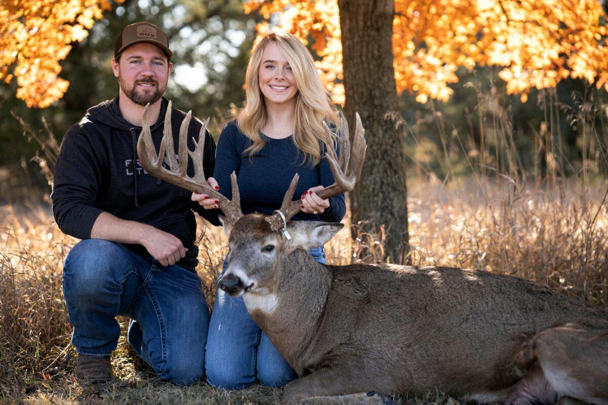 Cole Bures and Samantha Camenzind pose with the deer she shot near Filley, Neb., before he proposed to her, on Nov. 12, 2023. (Brenton Lammers/Lammers Media via AP)