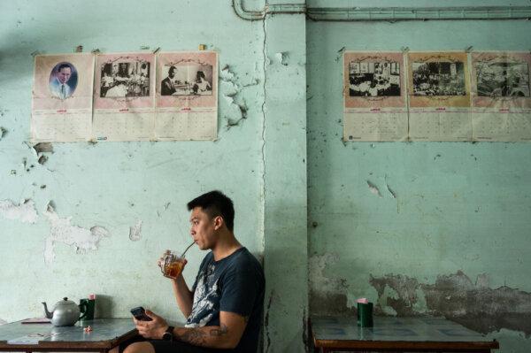 A man drinks tea in a restaurant in Hat Yai, Thailand, on Nov. 30, 2020. (Sirachai Arunrugstichai/Getty Images)