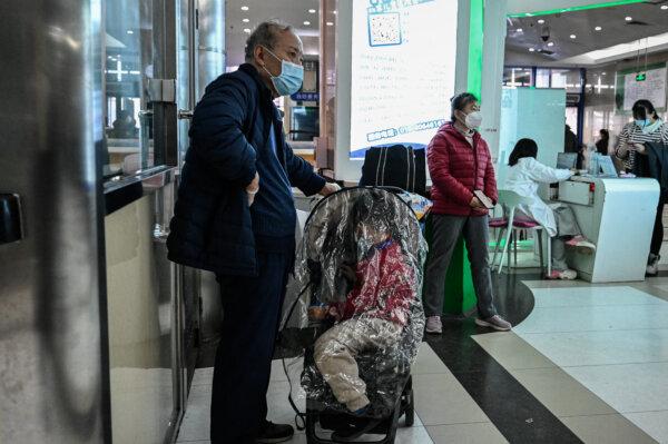 Children and their parents wait at an outpatient room at a children's hospital in Beijing, China, on Nov. 23, 2023. (Jade Gao/AFP via Getty Images)