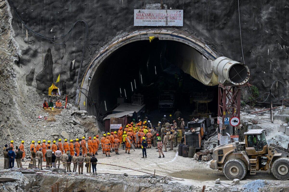National Disaster Response Force (NDRF) personnel along with other rescue operatives gather near the face of the collapsed under construction Silkyara tunnel in the Uttarkashi district of India's Uttarakhand state, on Nov. 28, 2023. (Sajjad Hussain/AFP via Getty Images)