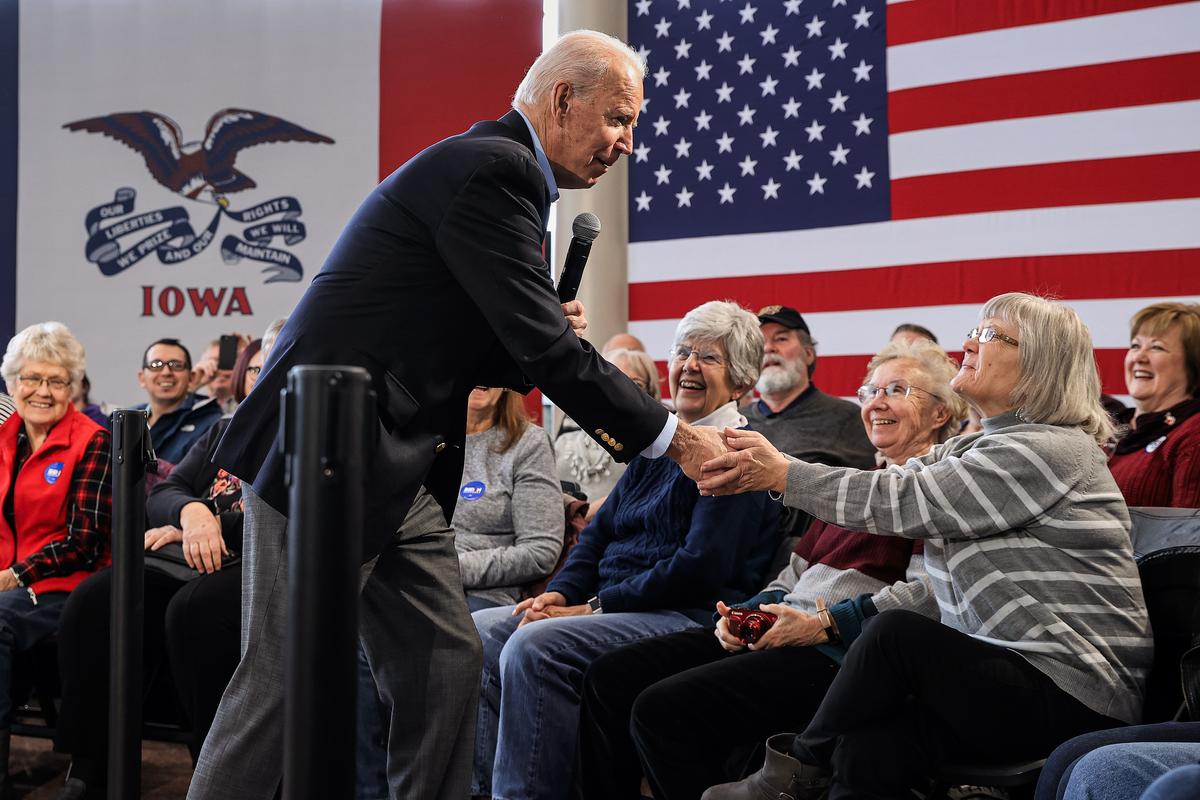 Then-presidential candidate former Vice President Joe Biden greets supporters as he arrives for a campaign town hall on the campus of University of Northern Iowa in Cedar Falls, Iowa, on Jan. 27, 2020. (Chip Somodevilla/Getty Images)