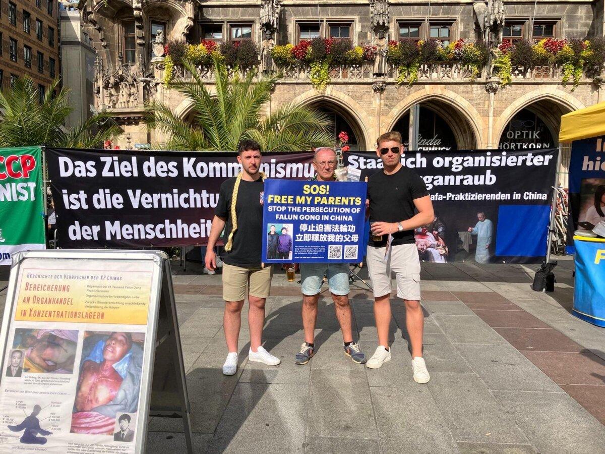 Passersby hold a banner in support of Lebin Ding after hearing about the persecution of his family in China, in Munich, Germany, on Sept. 30, 2023. (Courtesy of Lebin Ding)
