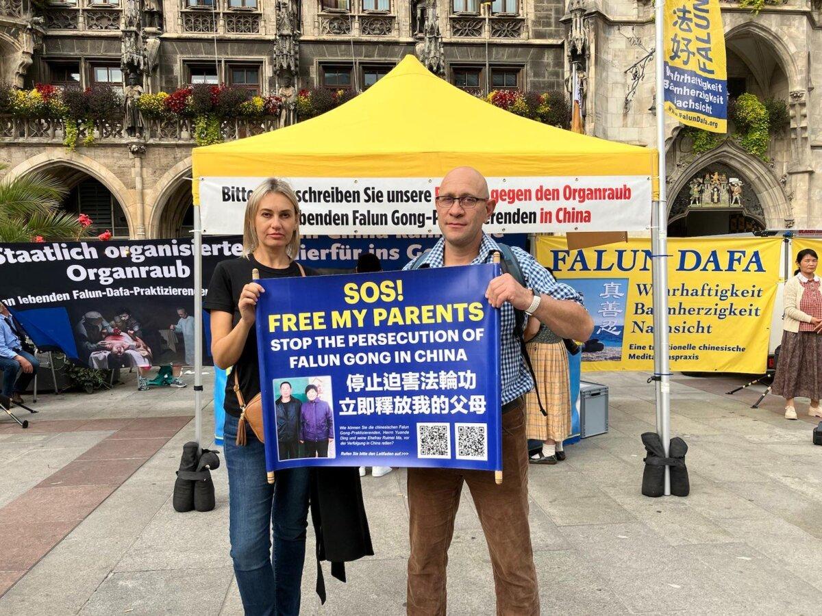 Passersby hold a banner in support of Lebin Ding after hearing about the persecution of his family in China, in Munich, Germany, on Sept. 30, 2023. (Courtesy of Lebin Ding)