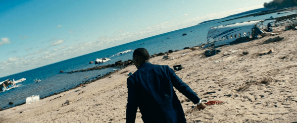 G.H. (Mahershala Ali) finds evidence of widespread GPS and electrical malfunctions on the beach, in "Leave the World Behind." (Jojo Whilden/Higher Ground Productions/Netflix)