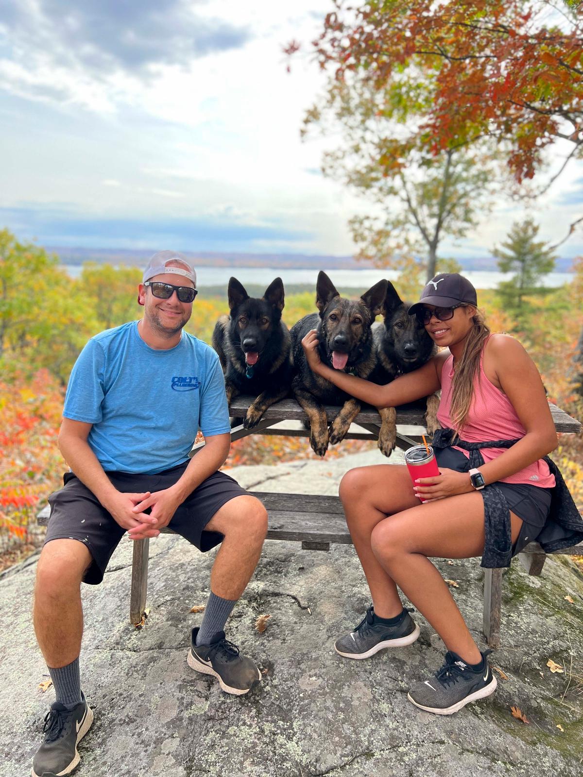 Mr. and Mrs. Moise with their three dogs: Jet, Jasper, and Jade. (Courtesy of <a href="https://www.instagram.com/jadethesablegsd">Jade the Sable GSD</a>)
