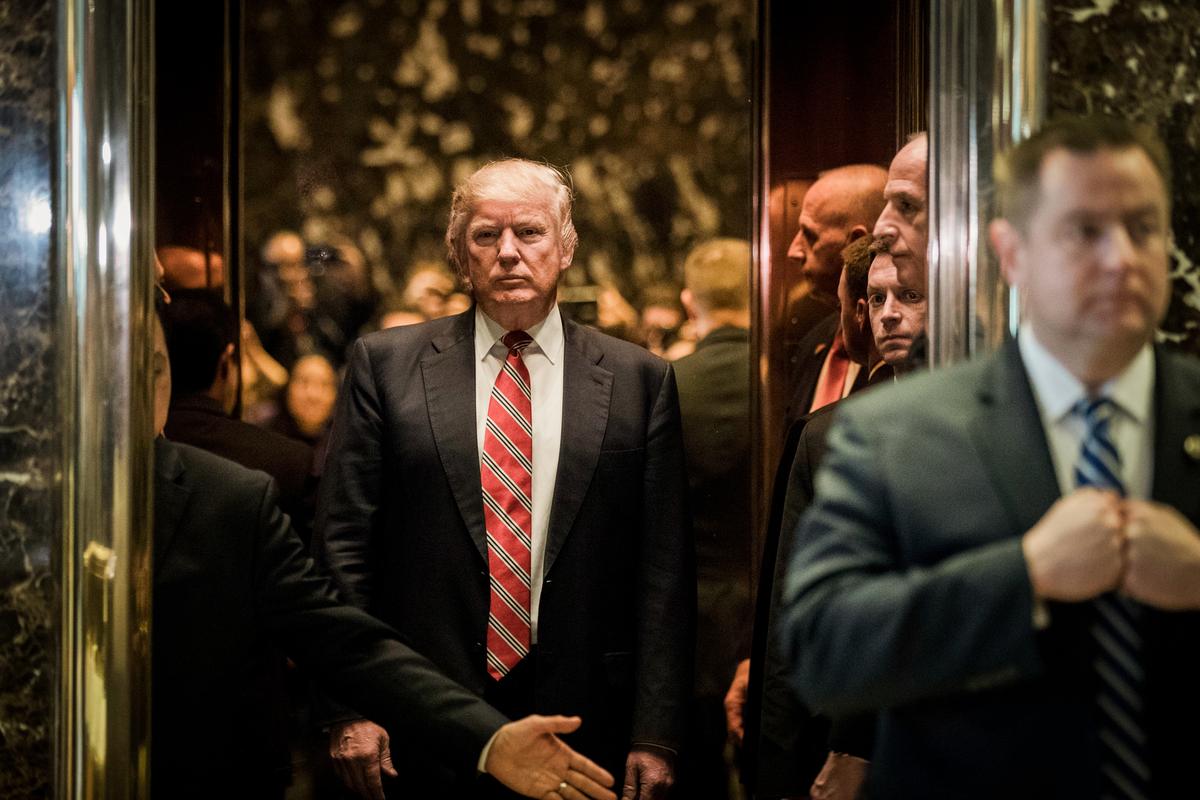President-elect Donald Trump heads back into the elevator after shaking hands with Martin Luther King III after their meeting at Trump Tower in New York City on Jan. 16, 2017. (Drew Angerer/Getty Images)