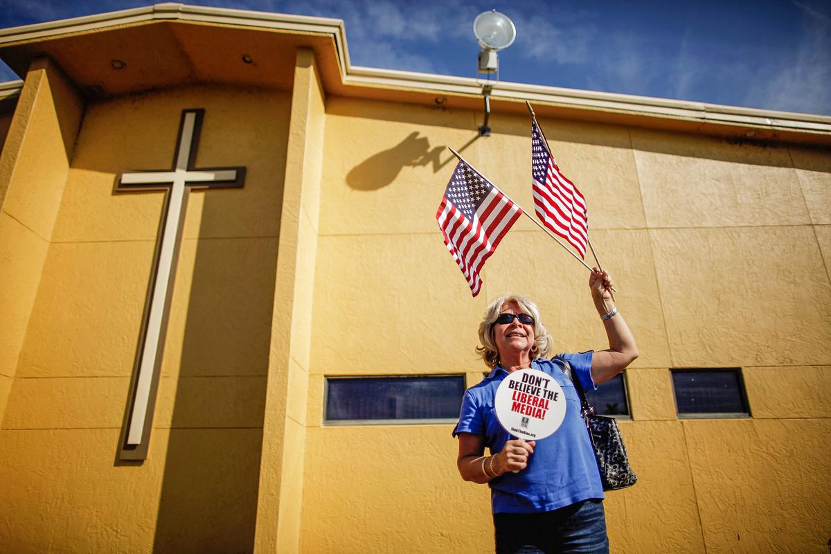  A supporter stands outside Centro de la Familia evangelical church in Orlando, Fla., on Jan. 28, 2012. (Chip Somodevilla/Getty Images)