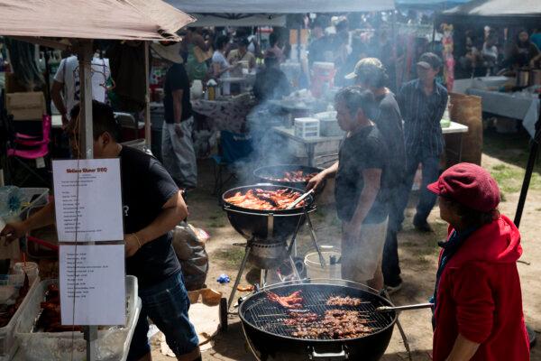 Smoke fills the air near grills at the Southeast Asian Market at FDR Park in Philadelphia on May 7, 2023. The market is open on Saturdays and Sundays from April to October. (Monica Herndon/The Philadelphia Inquirer/TNS)