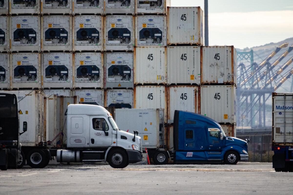 Truckers transport cargo in the Port of Long Beach, Calif., on Nov. 29, 2023. (John Fredricks/The Epoch Times)