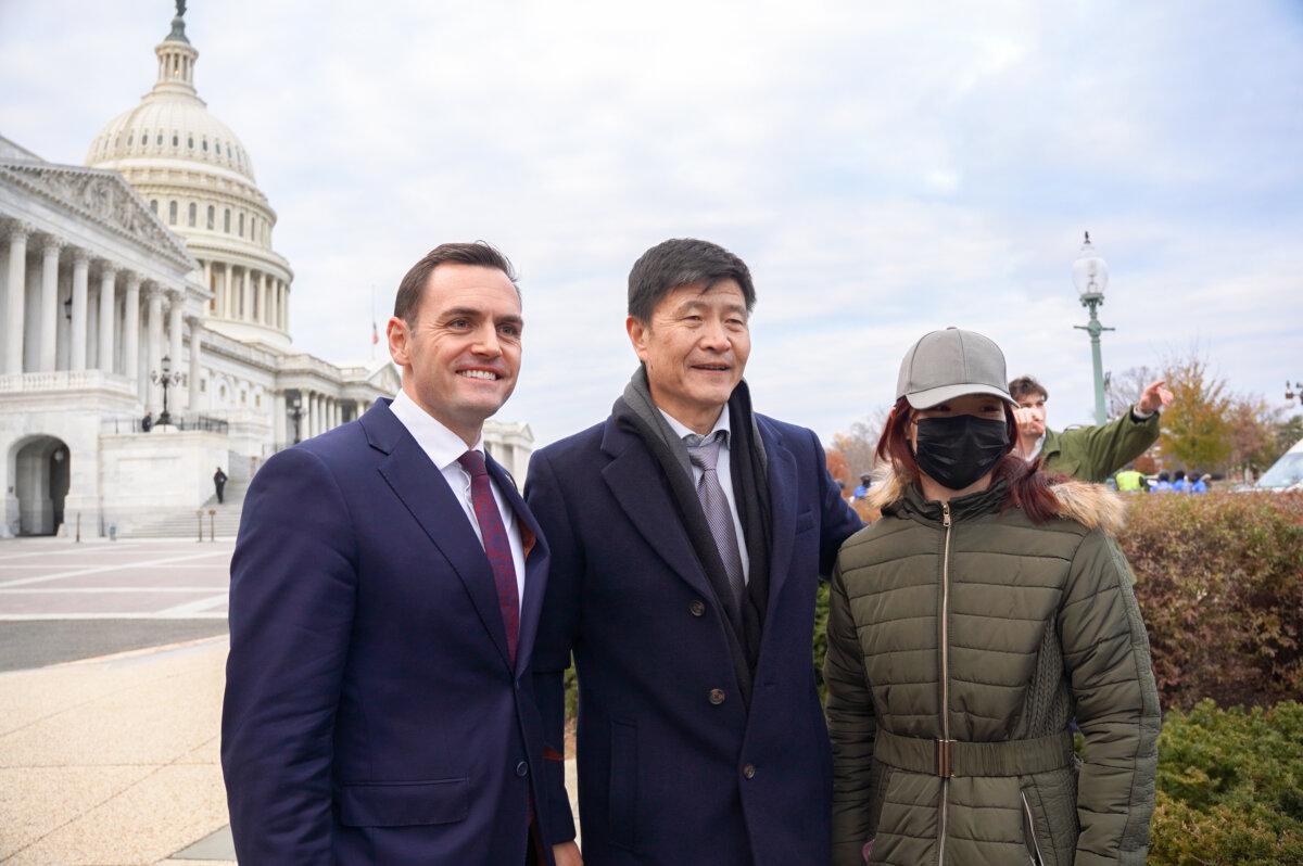 Rep. Mike Gallagher (R-Wis.) (left), chair of the House Select Committee on the Chinese Communist Party, Zhou Fengsuo (center), executive director of Human Rights in China, and Lesley, a pro-democratic activist from Boston, outside the U.S. Capitol on Nov. 29, 2023. (Terri Wu/The Epoch Times)