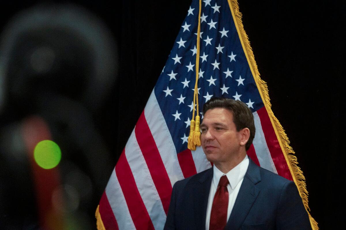 Florida Gov. and Republican presidential hopeful Ron DeSantis speaks in the spin room following a debate held by Fox News, in Alpharetta, Georgia, on Nov. 30, 2023.(Christian Monterrosa/ AFP)