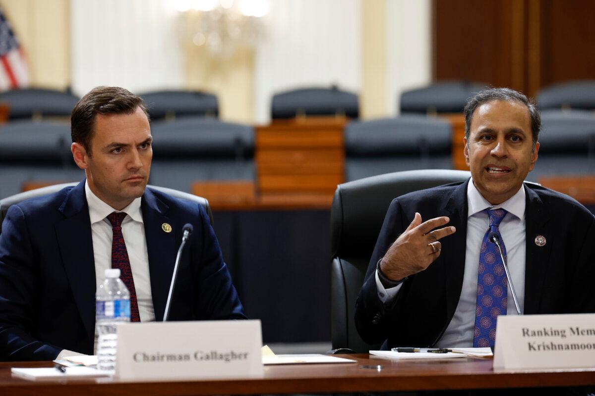 Ranking Member Raja Krishnamoorthi (D-Ill.) (R) speaks as Chairman Mike Gallagher (R-Wis.) (L) listens during a press conference with members of the House Select Committee on the Chinese Communist Party at the Cannon House Office Building in Washington on Nov. 15, 2023. (Anna Moneymaker/Getty Images)