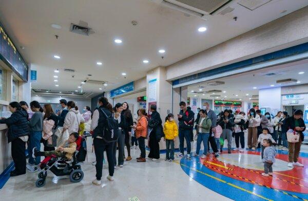 Parents with children suffering from respiratory diseases line up at a children's hospital in Chongqing, China, on Nov. 23, 2023. (CFOTO/Future Publishing via Getty Images)