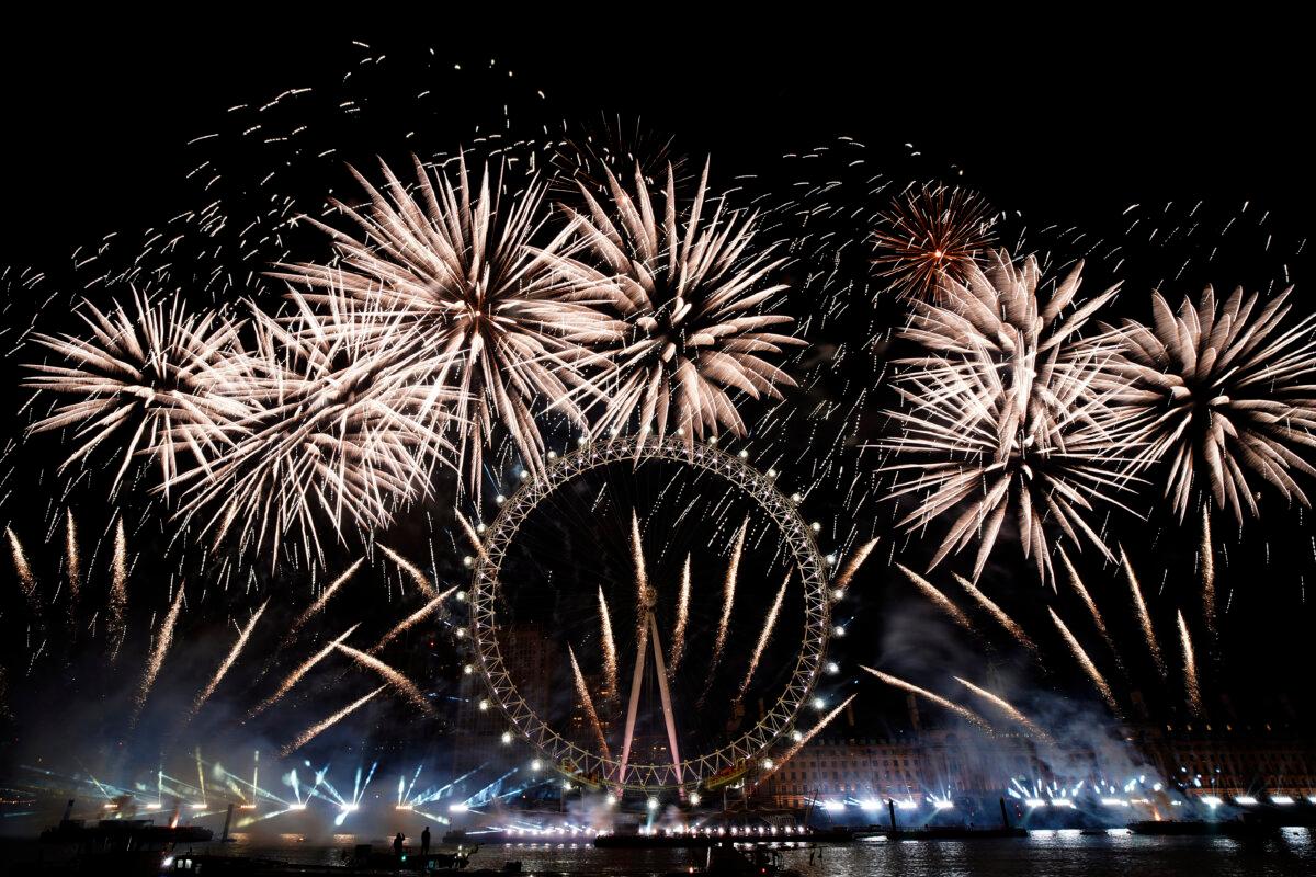  Fireworks light-up the sky over the London Eye in central London to celebrate the New Year on Jan. 1, 2024. (Alberto Pezzali/AP Photo)
