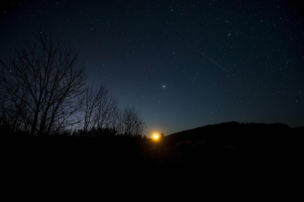 The Geminid meteor shower is seen while the moon rises late on December 13, 2014, above Skopje, Macedonia. (ROBERT ATANASOVSKI/AFP via Getty Images)