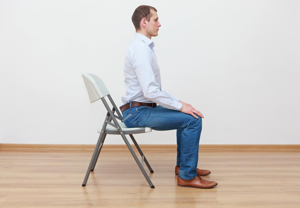  The sitting posture for back muscle stretching exercise. (Marcin Balcerzak/Shutterstock)