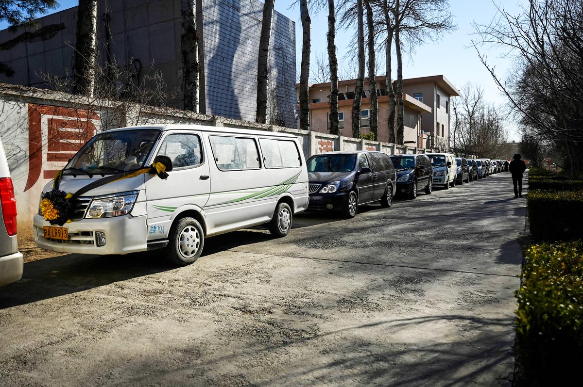 Hearses waiting to enter a crematory in Beijing on Dec. 22, 2022. The Chinese regime suddenly decided to lift years of lockdowns, quarantines, and mass testing. (STF/AFP via Getty Images)
