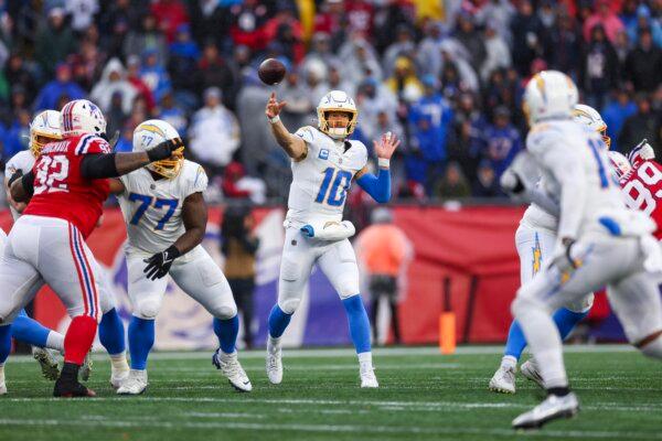 Justin Herbert (10) of the Los Angeles Chargers throws a pass in the second quarter against the New England Patriots in Foxborough, Mass., on Dec. 23, 2023. (Maddie Meyer/Getty Images)