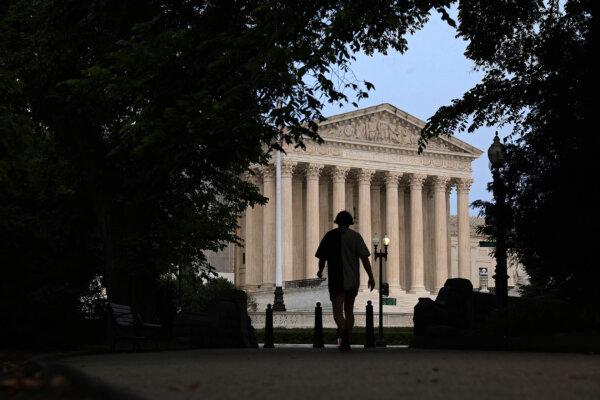 A pedestrian walks toward the U.S. Supreme Court in Washington on June 5, 2023. (Alex Wong/Getty Images)