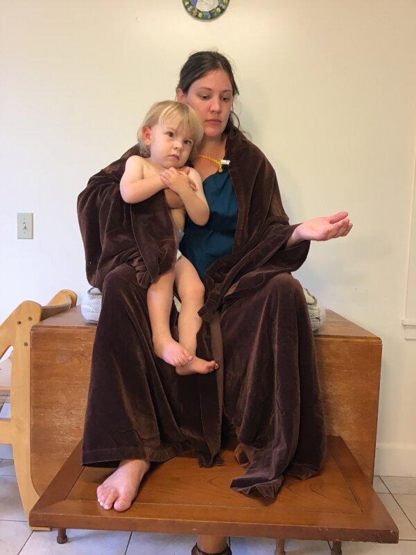 For every illustration she creates, Bernadette Carstensen makes reference studies, dressing her friends, family, and even herself in homemade biblical costumes. In this photograph, she poses with her son Christopher, as Mary and baby Jesus, respectively. (Courtesy of Bernadette Carstensen)