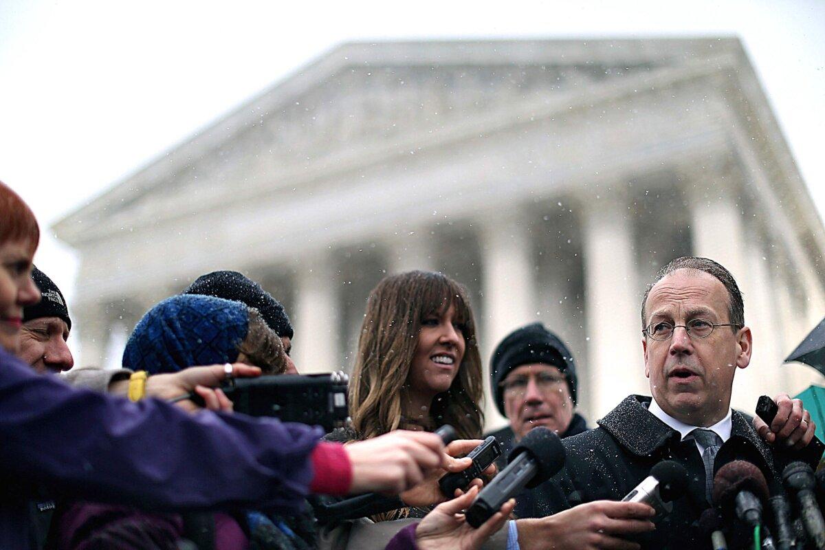 Former U.S. Solicitor General Paul Clement (R) talks to reporters outside the U.S. Supreme Court in Washington on March 25, 2014. (Chip Somodevilla/Getty Images)