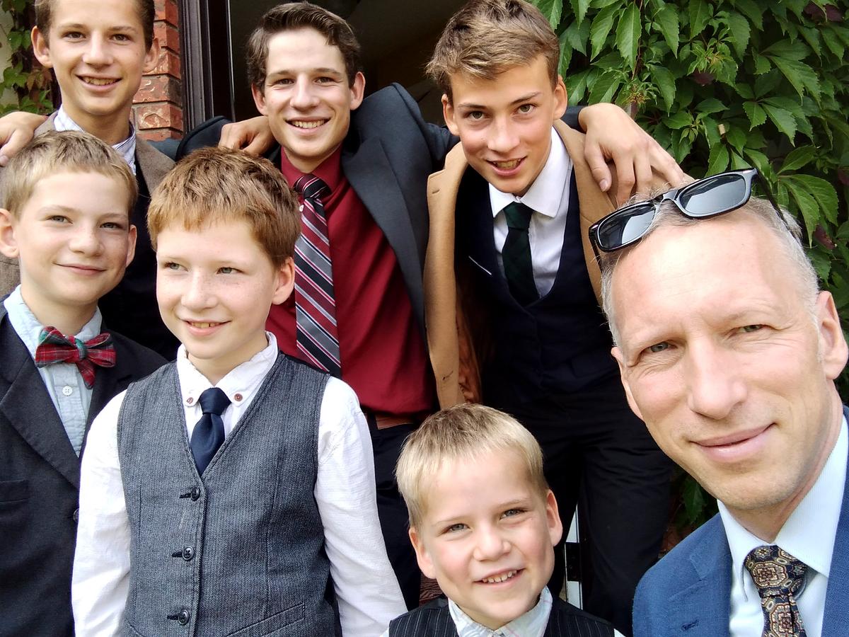 Mr. Topping with six of his sons, on Aug. 28, 2023. (Courtesy of Ryan Topping)