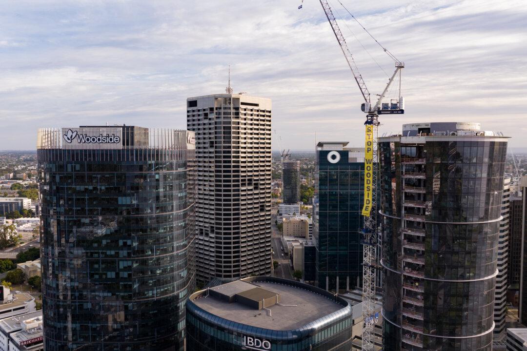 Climate Activists Scale 140-Metre Crane to Protest Woodside Petroleum