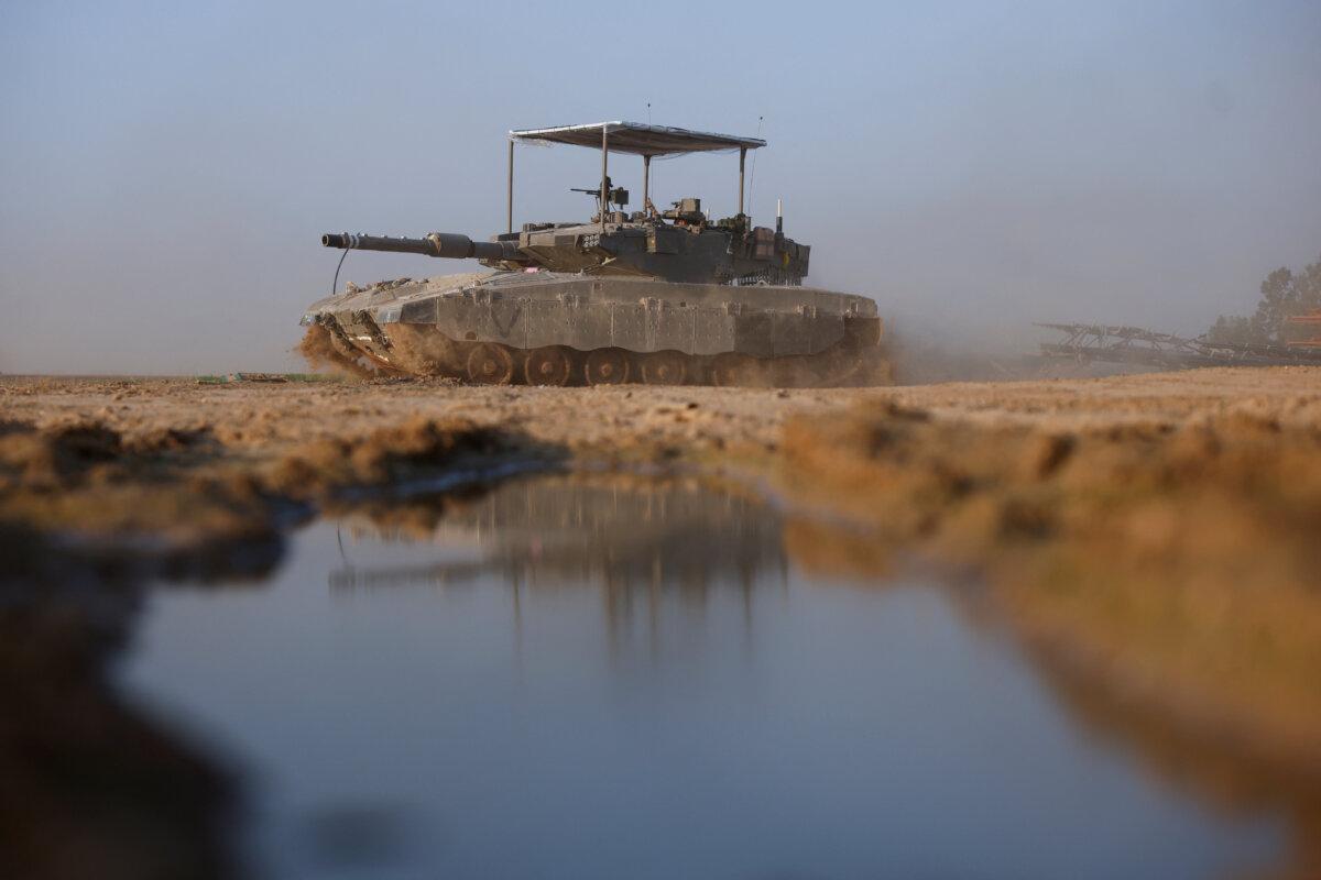 An Israeli tank maneuvers near Israel's border with southern Gaza, in Israel, on Dec. 4, 2023. (Amir Cohen/Reuters)