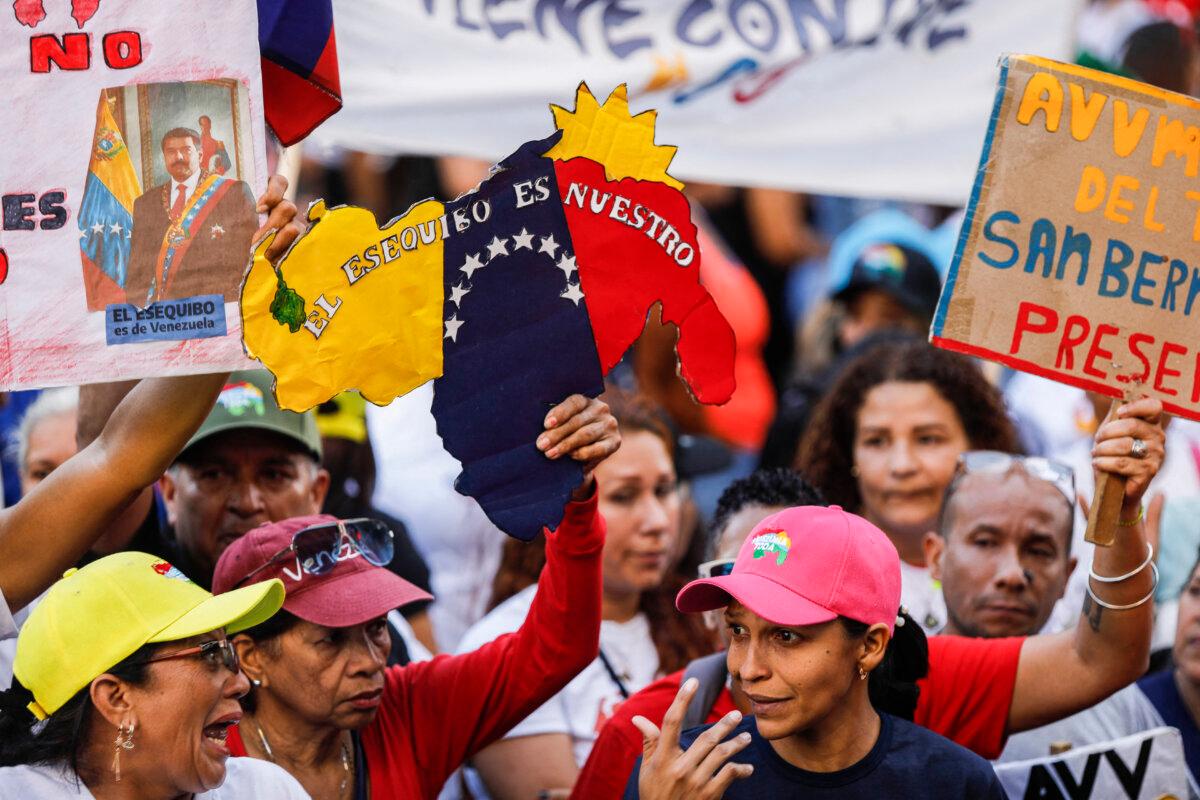 Supporters of the Chavismo movement take part in a march during the closing campaign ahead of the referendum on the Essequibo territory, in Caracas, Venezuela, on Dec. 1, 2023. (PEDRO RANCES MATTEY/AFP via Getty Images)