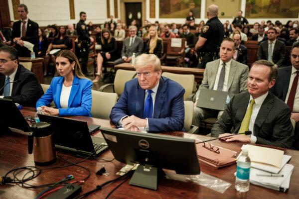 Former President Donald Trump sits in court with attorneys Alina Habba and Christopher Kise during his civil fraud trial at New York State Supreme Court in New York City on Oct. 25, 2023. (Seth Wenig/Getty Images)