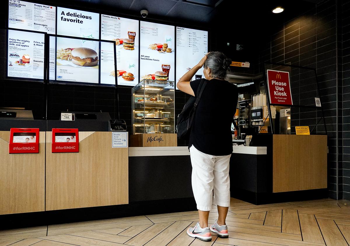 A customer waits to order food at a McDonald's fast-food restaurant on July 26, 2022, in Miami. (Joe Raedle/Getty Images)