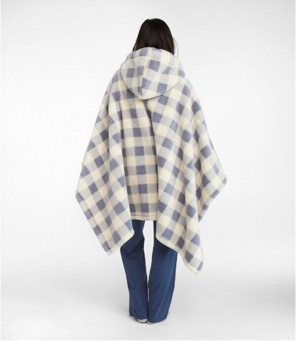 This Cozy Sherpa Wearable Throw keeps travelers warm on planes, in cars, or on a camping trip. (Courtesy of L.L. Bean)