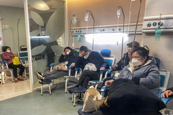 People receive medical attention in a Fever Clinic area in a hospital in the Changning district in Shanghai on Dec. 23, 2022 (HECTOR RETAMAL/AFP via Getty Images)