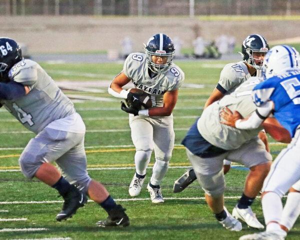 Senior running back and linebacker Ryan Heredia (9) plays for Mayfair High School in a recent football game. (Courtesy of Ted Meyers)