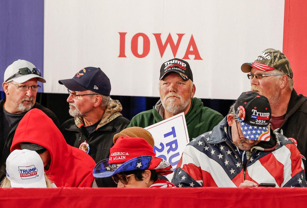 Supporters of former President Donald Trump wait to hear him speak during a caucus event in Waterloo, Iowa, on Oct. 7, 2023. (KAMIL KRZACZYNSKI/AFP via Getty Images)