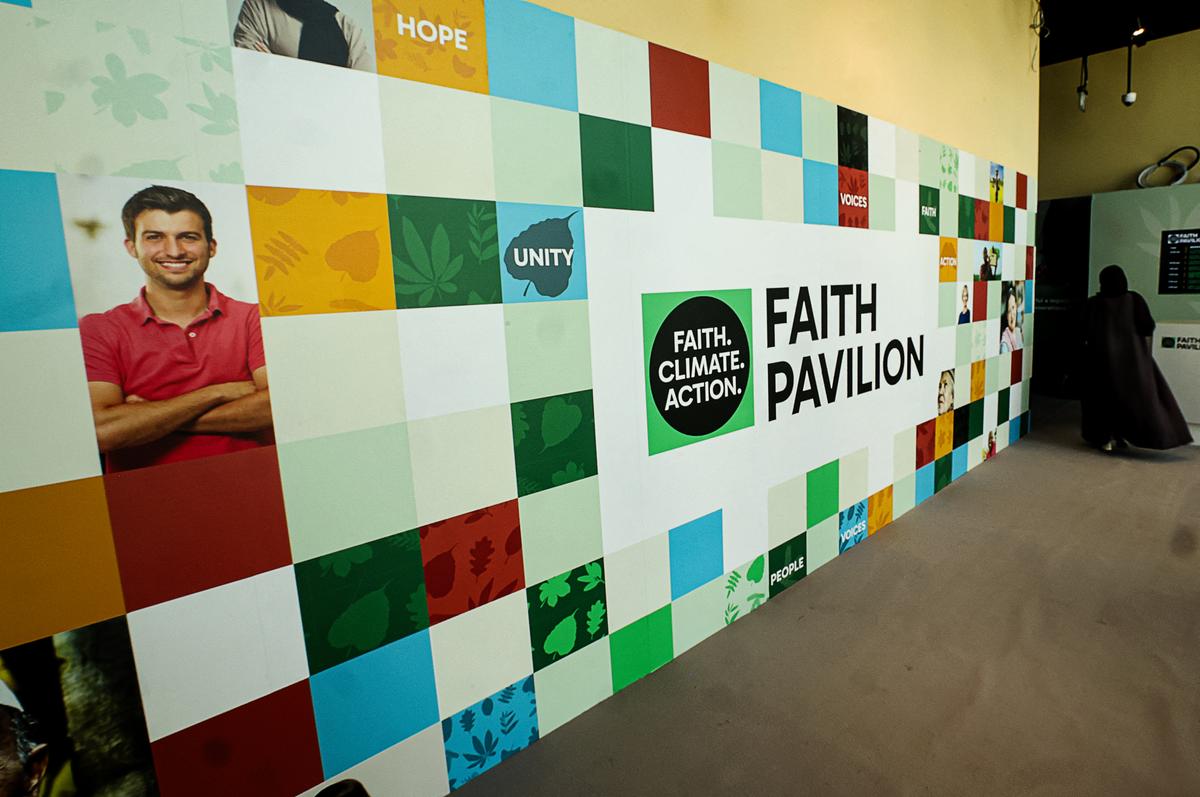 A woman walks into the "faith pavilion" at the COP28 United Nations climate summit venue in Dubai, United Arab Emirates, on Dec. 6, 2023. (Giuseppe CACACE/AFP via Getty Images)