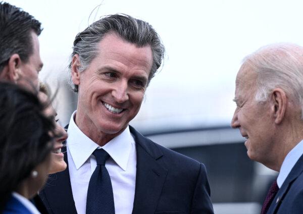 President Joe Biden (R) greets California Gov. Gavin Newsom and others after disembarking Air Force One at San Francisco International Airport in San Francisco on Nov. 14, 2023, as he arrives to attend the Asia-Pacific Economic Cooperation (APEC) leaders' week. (Brendan Smialowski/AFP via Getty Images)