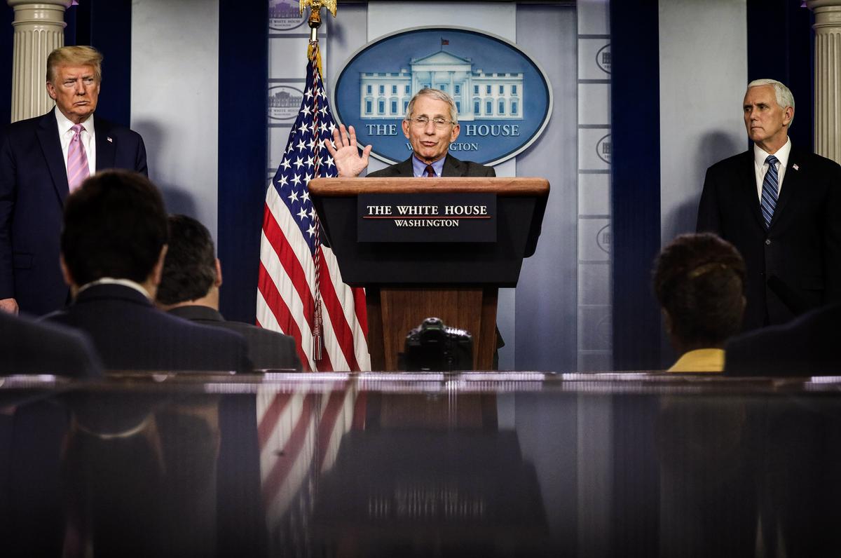 Dr. Anthony Fauci, director of the National Institute of Allergy and Infectious Diseases (C), speaks as President Donald Trump and Vice President Mike Pence look on during a press briefing at the White House in Washington on April 10, 2020. (Alex Wong/Getty Images)