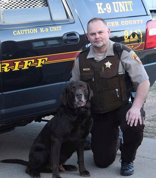 Sheriff's Deputy Paul Martin with his retired K9 Goliath in a file photo.(Mercer County Sheriff’s Office via AP)