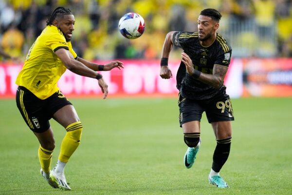 Columbus Crew's Steven Moreira (L) and Los Angeles FC's Denis Bouanga (R) chase after the ball in the first half of the MLS soccer championship match in Columbus, Ohio, on Dec. 9, 2023. (Sue Ogrocki/AP Photo)