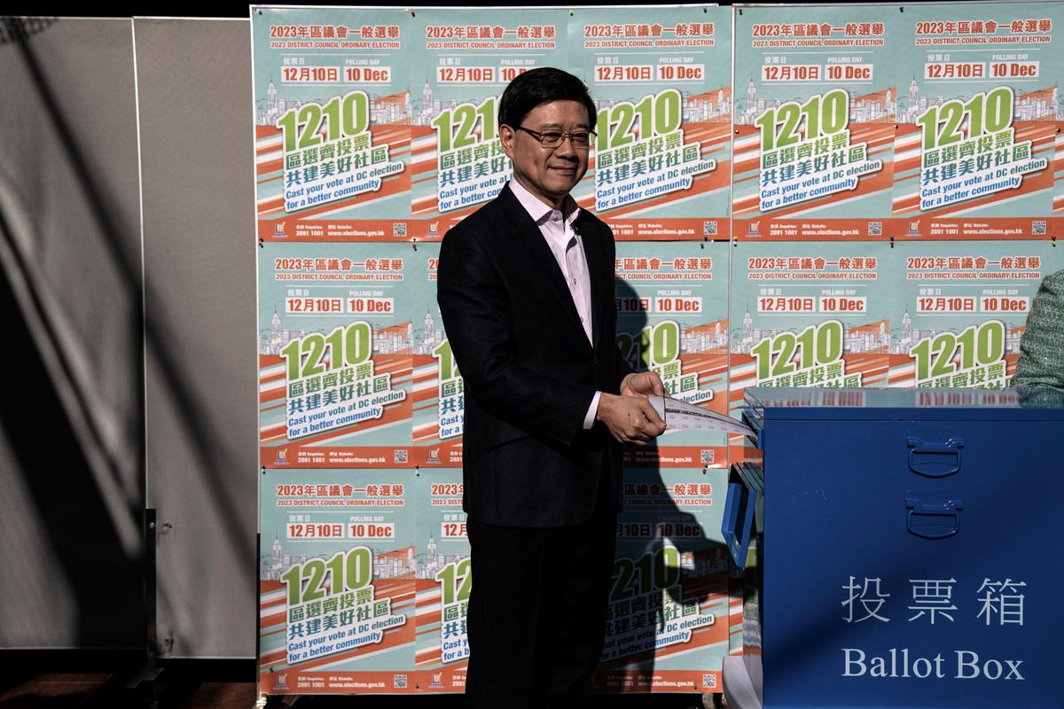 Hong Kong Holds 1st Council Elections Under New Rules That Shut Out Pro-Democracy Candidates, Activists Arrested