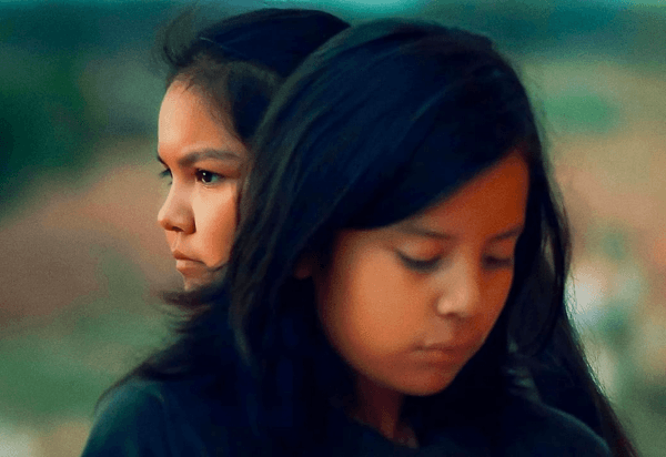 11-year-old Benny (Keir Tallman, foreground) and his cousin Dawn (Charley Hogan) is deposited for the summer at his grandmother’s sheep ranch, in “Frybread Face and Me.” (Indion Entertainment/Array Releasing)