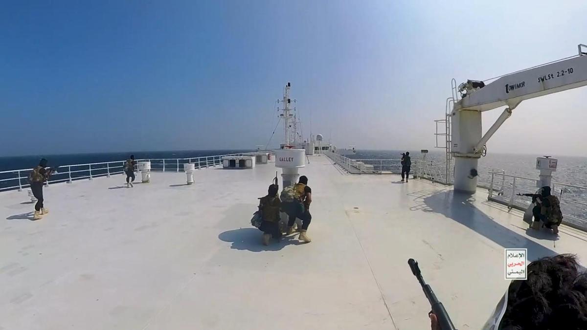 This handout screen grab captured from a video shows Yemen's Houthis fighters' takeover of the Galaxy Leader Cargo off the coast of Hudaydah, in the Red Sea, Yemen, on Nov. 20, 2023. (Houthi Movement via Getty Images)