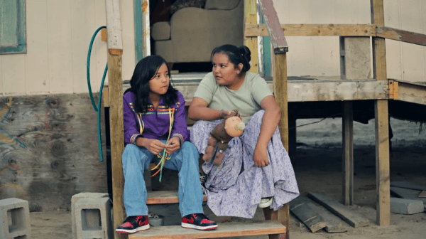 Benny (Keir Tallman, L) and his cousin Dawn (Charley Hogan) at their grandmother’s trailer in “Frybread Face and Me.” (Indion Entertainment/Array Releasing)