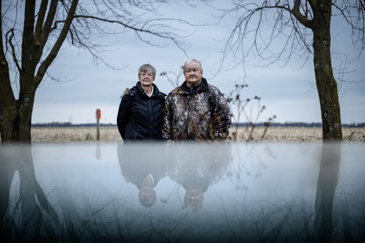  Susan Burns and her husband John Burns in their front yard, which has been in the family since 1890, across from land that has been leased for solar energy production in Hereford, Mo., on March 16, 2023. (Brendan Smialowski/AFP via Getty Images)