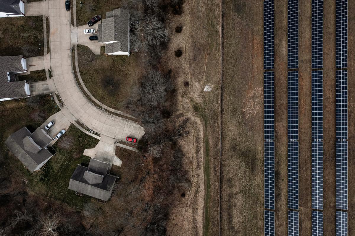  An aerial view of a solar farm next to a housing development in Columbia, Mo., on March 15, 2023. (Brendan Smialowski/AFP via Getty Images)